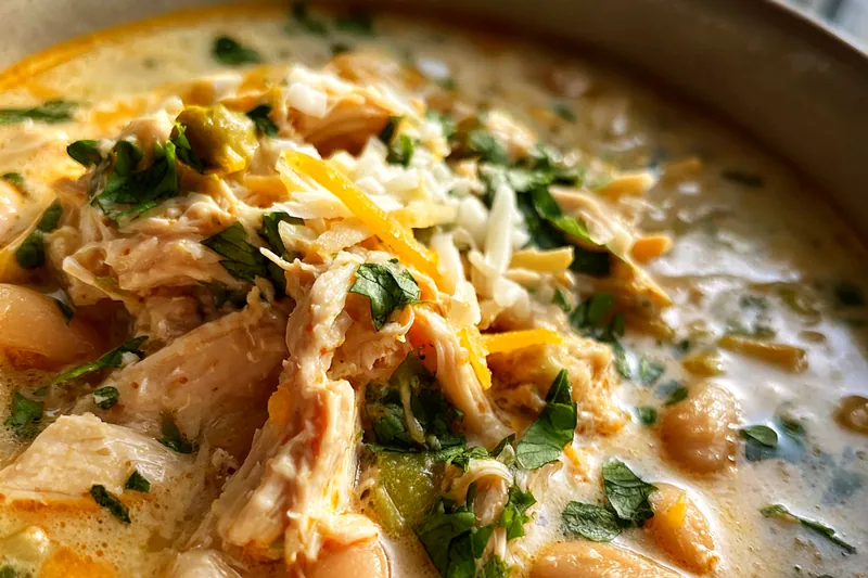 Ingredients for white chicken chili displayed on a wooden table