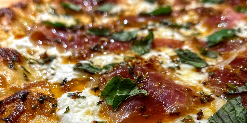 Delicious Prosciutto Honey Pizza Delight served on a plate