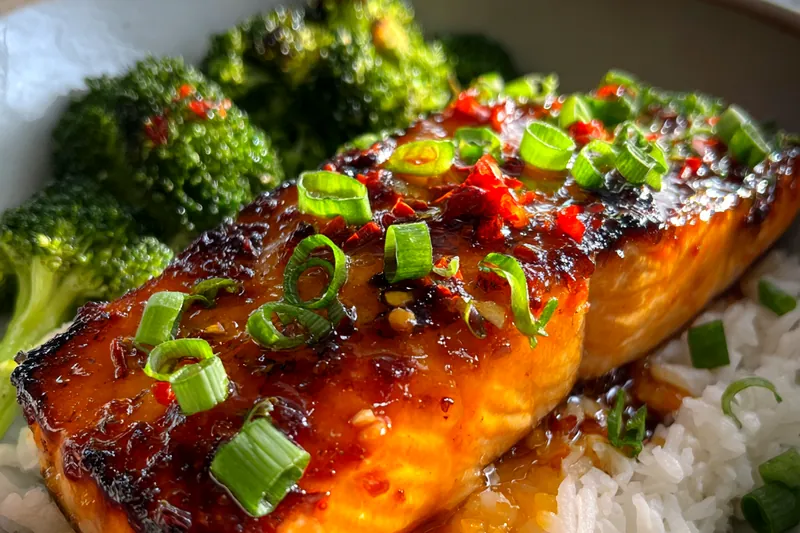 A beautiful arrangement of fresh ingredients for Savory Firecracker Salmon including salmon, sauces, and seasonings.