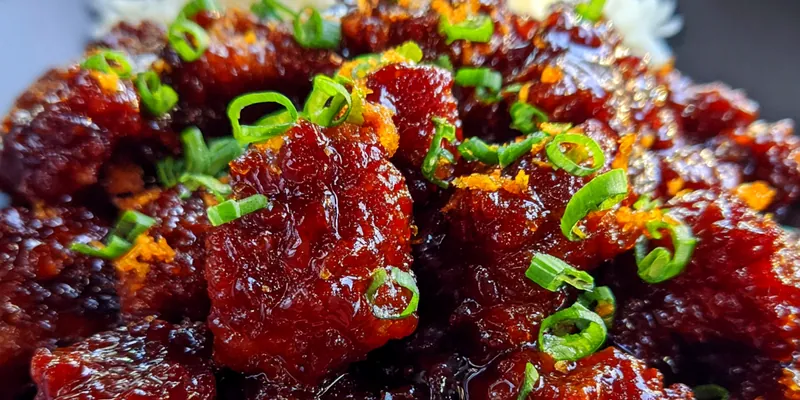Delicious Sticky Glazed Chicken Bites served on a plate