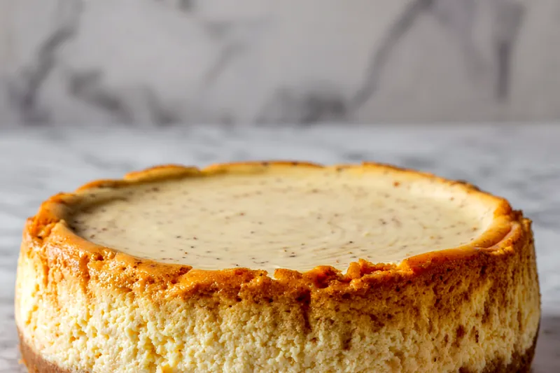 Ingredients for vanilla bean butter cheesecake laid out on a table